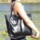 Женская кожаная сумка с карманами лак черная